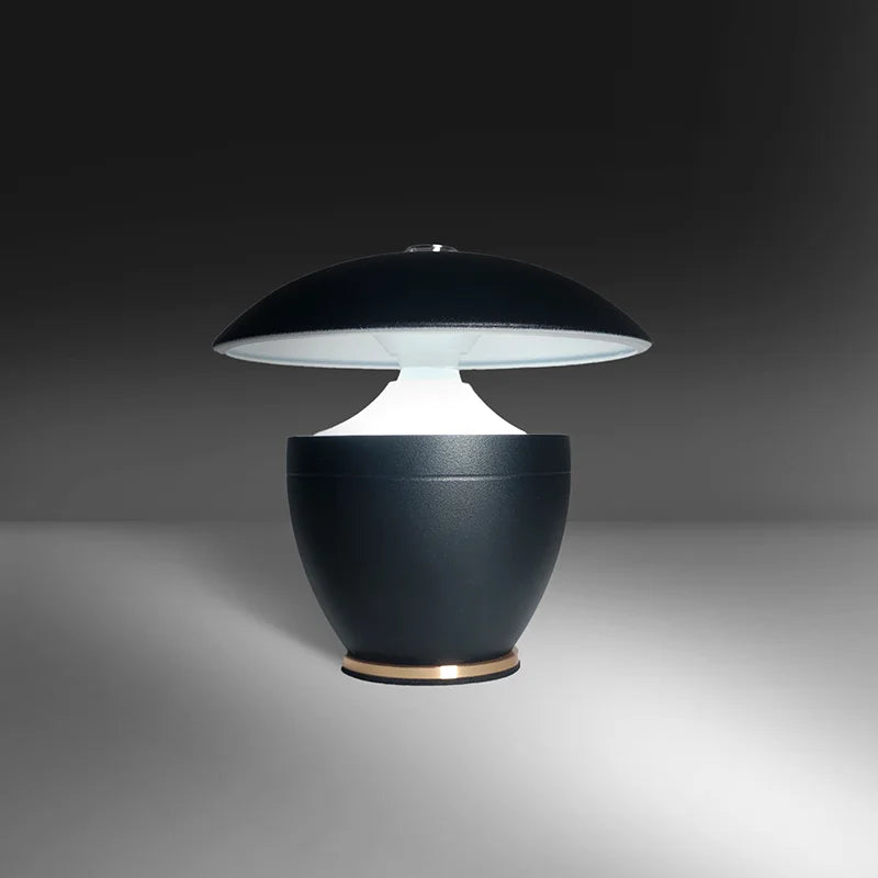 Modern black table lamp with a white shade on a gray background