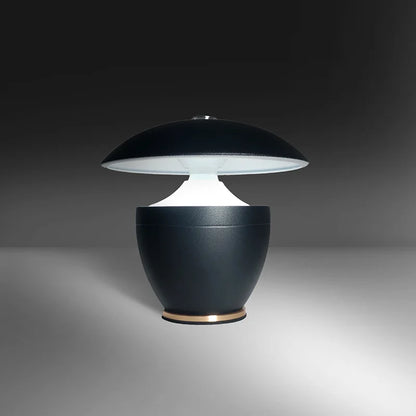 Modern black table lamp with a white shade on a gray background