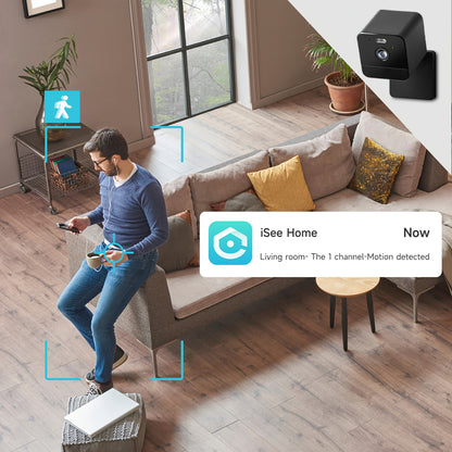 Living room with a person using a device, a camera on the wall, and an 'iSee Home' app notification.